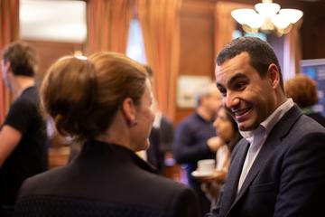 Photo of Emre Korkmaz greeting workshop participants